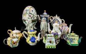 A Collection of Porcelain to include three enamelled tea pots marked Trade Aid,