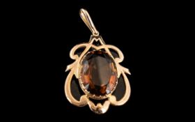 A 9ct Rose Gold Edwardian Pendant Drop, central smoky quartz in an Art Nouveau mount, stamped 9 ct.