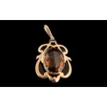 A 9ct Rose Gold Edwardian Pendant Drop, central smoky quartz in an Art Nouveau mount, stamped 9 ct.