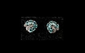 Sea Blue Apatite and Diamond Arch Shaped Earrings, each earring having six pear cut,