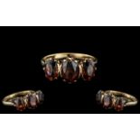 Ladies 9ct Gold - Attractive 3 Stone Garnet Set Ring - Gallery Setting. Fully Hallmarked for 9.