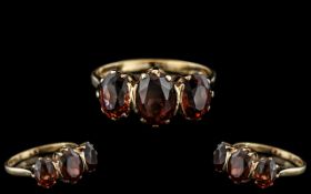 Ladies 9ct Gold - Attractive 3 Stone Garnet Set Ring - Gallery Setting. Fully Hallmarked for 9.