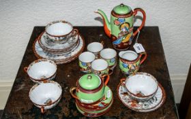 Two Japanese Tea Sets, comprising an eggshell tea set with a tea pot, sugar bowl, milk jug, four