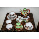 Two Japanese Tea Sets, comprising an eggshell tea set with a tea pot, sugar bowl, milk jug, four