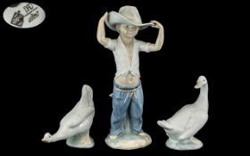 Three Nao Figures, comprising ''Boy, Big Hat'' from the Youth & Childhood collection sculpted by