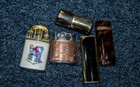 Collection of Five Cigarette Lighters, assorted styles.