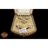 A Cased Set of Mother of Pearl Buttons, with gold fronts set of five buttons, in a silk lined case.