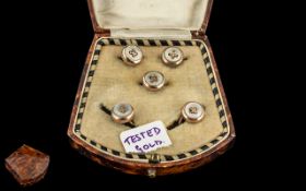 A Cased Set of Mother of Pearl Buttons, with gold fronts set of five buttons, in a silk lined case.