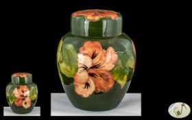 Moorcroft Tube lined Lidded Ginger Jar ' Coral Hibiscus ' Design on Green Ground. Signed to Base.