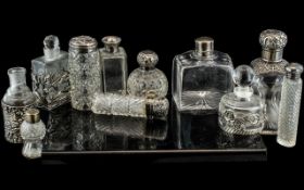 A Collection of Glass Scent Bottles, mostly silver mounted, various shapes and sizes,