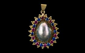 14ct Yellow Gold - Attractive Sapphires and Rubies Set Ornate Oval Shaped Pendant Drop.