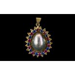 14ct Yellow Gold - Attractive Sapphires and Rubies Set Ornate Oval Shaped Pendant Drop.