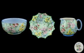 Three Pieces of Shelley 'Melody' Chintz Bone China, comprising: a fluted edged pin dish No 5/6033,