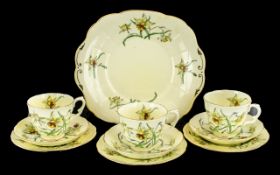 Staffordshire Crown Pottery Tea Service, in yellow ground decorated with daffodils,