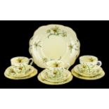 Staffordshire Crown Pottery Tea Service, in yellow ground decorated with daffodils,