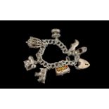 Vintage - Sterling Silver Charm Bracelet Loaded with 7 Silver Charms.
