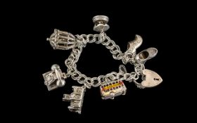 Vintage - Sterling Silver Charm Bracelet Loaded with 7 Silver Charms.