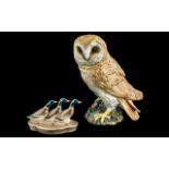 Beswick Large Owl, measures 8'' tall, marked underneath, small chip to base, together with a Beswick