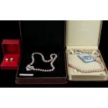 ( 2 ) Boxes of Cultured Coloured Pearls of Matched Sizes with Clasps. 15 Inches In length, With a