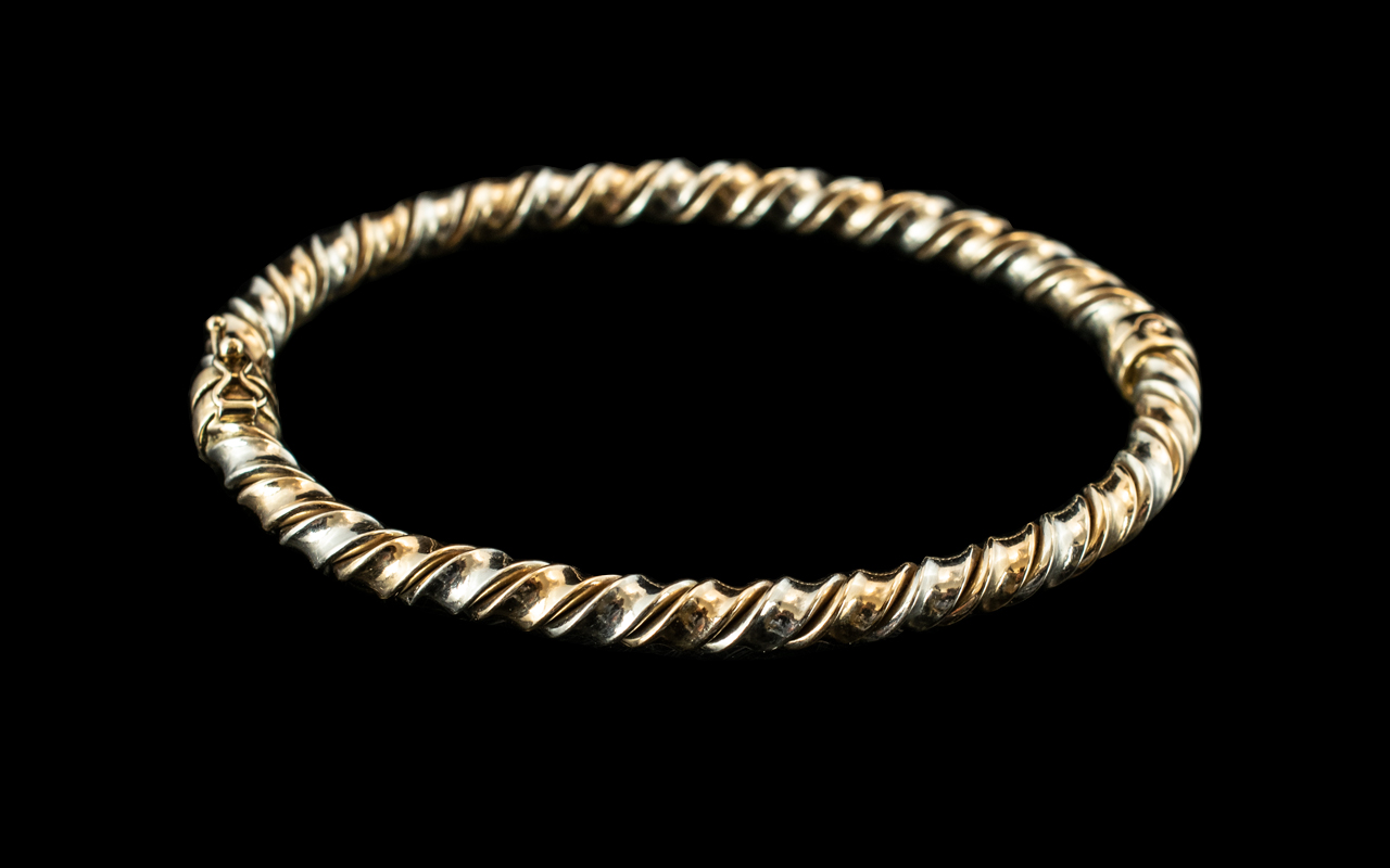 Ladies - Two-Tone 9ct Gold Hinged Bangle of Twist Design. Full Hallmark for 9ct. c.1980's.