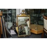 Regency Style Gilt Gesso Mirror of elegant form, surmounted by an urn, with floral swags which