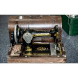 Vintage Singer Sewing Machine, Serial No. Y6209308. In wooden case.