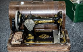 Vintage Singer Sewing Machine, Serial No. Y6209308. In wooden case.