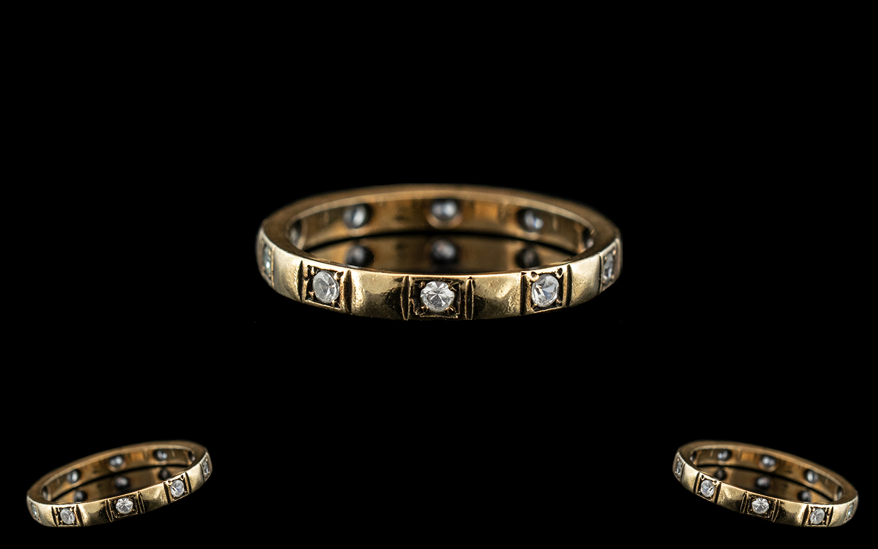 9ct Gold Eternity Ring, set with white faceted sapphires. Weight 2 grams.