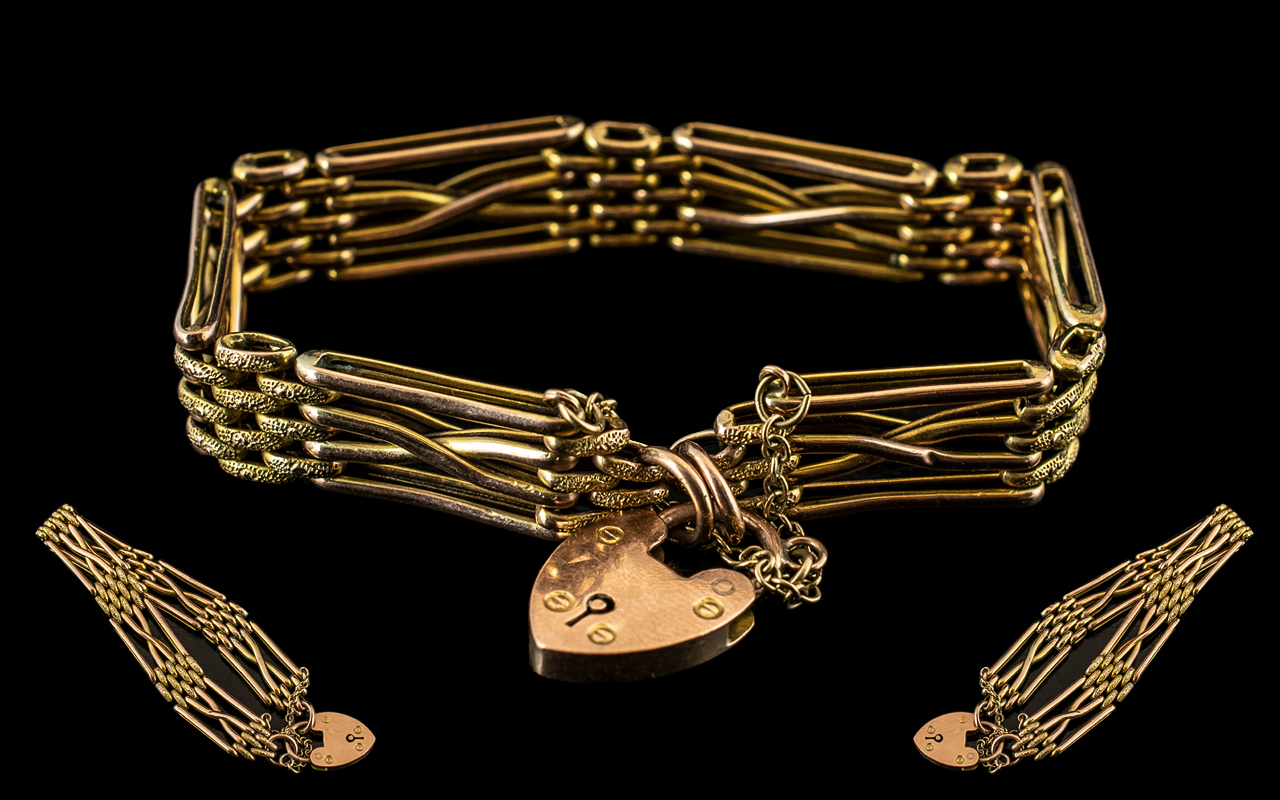 Ladies 9ct Gold Fancy 4 Bar Gate Bracelet with Heart Shaped Padlock. Fully Hallmarked for 9ct - 375.