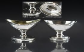 George III - Matched Pair of Large Sterling Silver Boat Shaped Salts. Hallmark London 1794 & 1829.