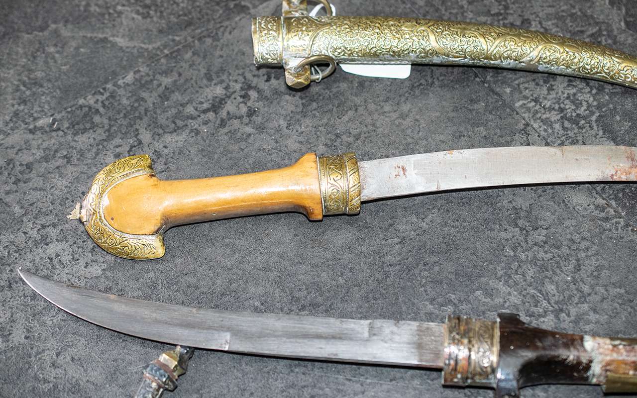 Two Middle Eastern Antique Daggers in brass and copper embossed sheaths, - Image 3 of 4