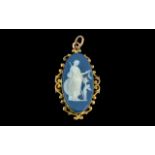 A Wedgwood Cameo Pendant oval classical scene in an oval mount. Approx 1.5 inches.