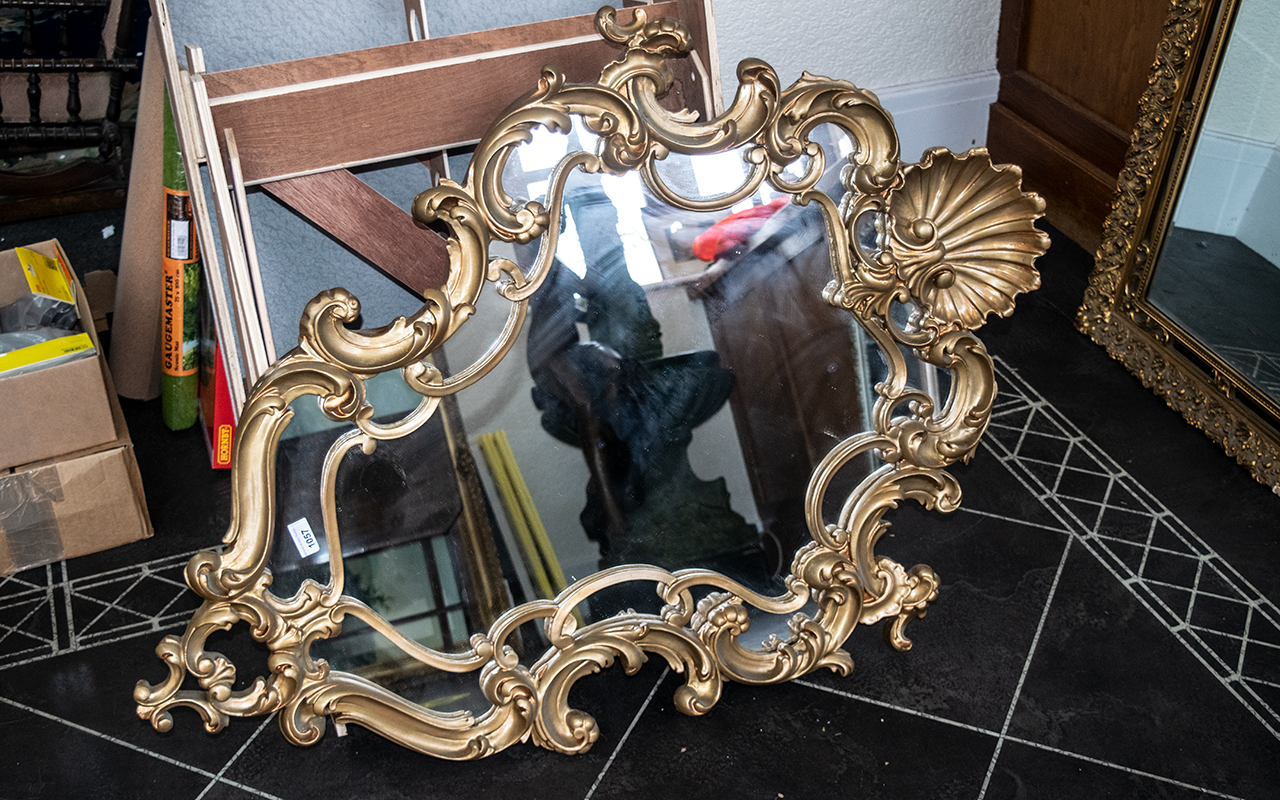 Rococo Gilt Framed Mirror, measures 46" x 33" overall.