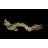 Large Antique Cast Bronze Chinese Recumbent Dragon, signed to the foot; 15 inches (37.