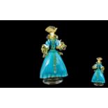 Murano Glass Lady Figurine, dressed in turquoise blue dress trimmed in pale yellow highlights.