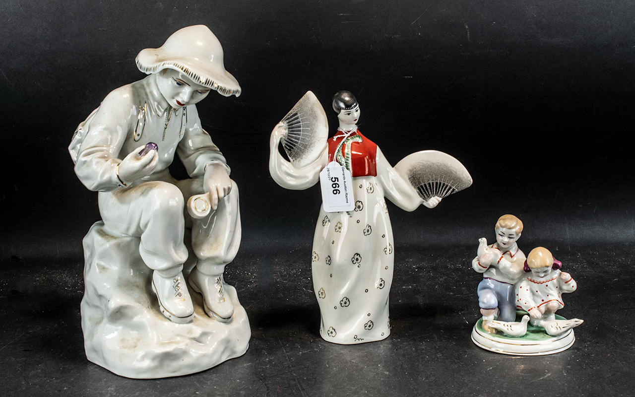 A Small Collection of Pottery to include a large Russian Porcelain figure of a seated boy 33 cms