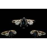 Ladies 9ct Gold - Attractive 3 Stone Diamond & Sapphire Set Dress Ring.