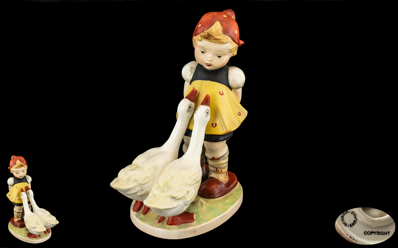 A Beswick 'Goose Girl' Figure number 905. Measures 6 inches. Beswick England stamp to base.