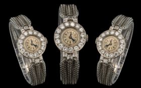 A Ladies Early 20thC Platinum And Diamond Cocktail Watch a silvered dial with Arabic Numerals,