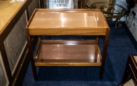 A Teak Two Shelf Trolley 1950's, raised on square legs with casters, height 26.5'' x 29.5 length x