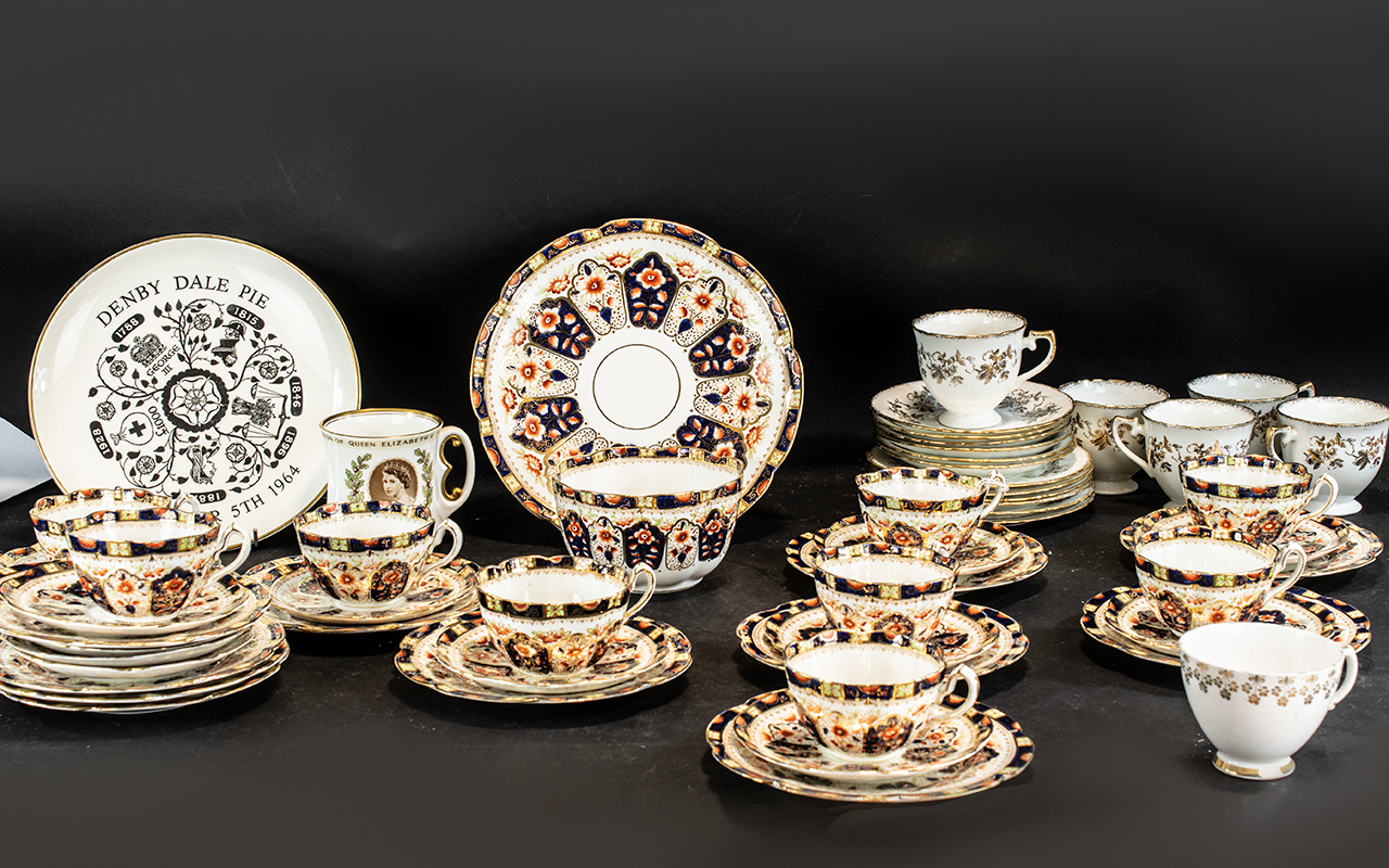 Court China Tea Service, comprising 9 cups, saucers and side plates, a large cake/sandwich plate,
