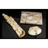 Small Mixed Lot to include: a Mother of Pearl Card Case, a small bone carving with figures,