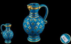 Minton Late 19th Century Hand Painted Turquoise and Gold Mask Spout Jug of Bulbous Form.
