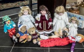 Collection of Dolls & Toys, comprising four bisque headed dolls in Victorian costume, on metal