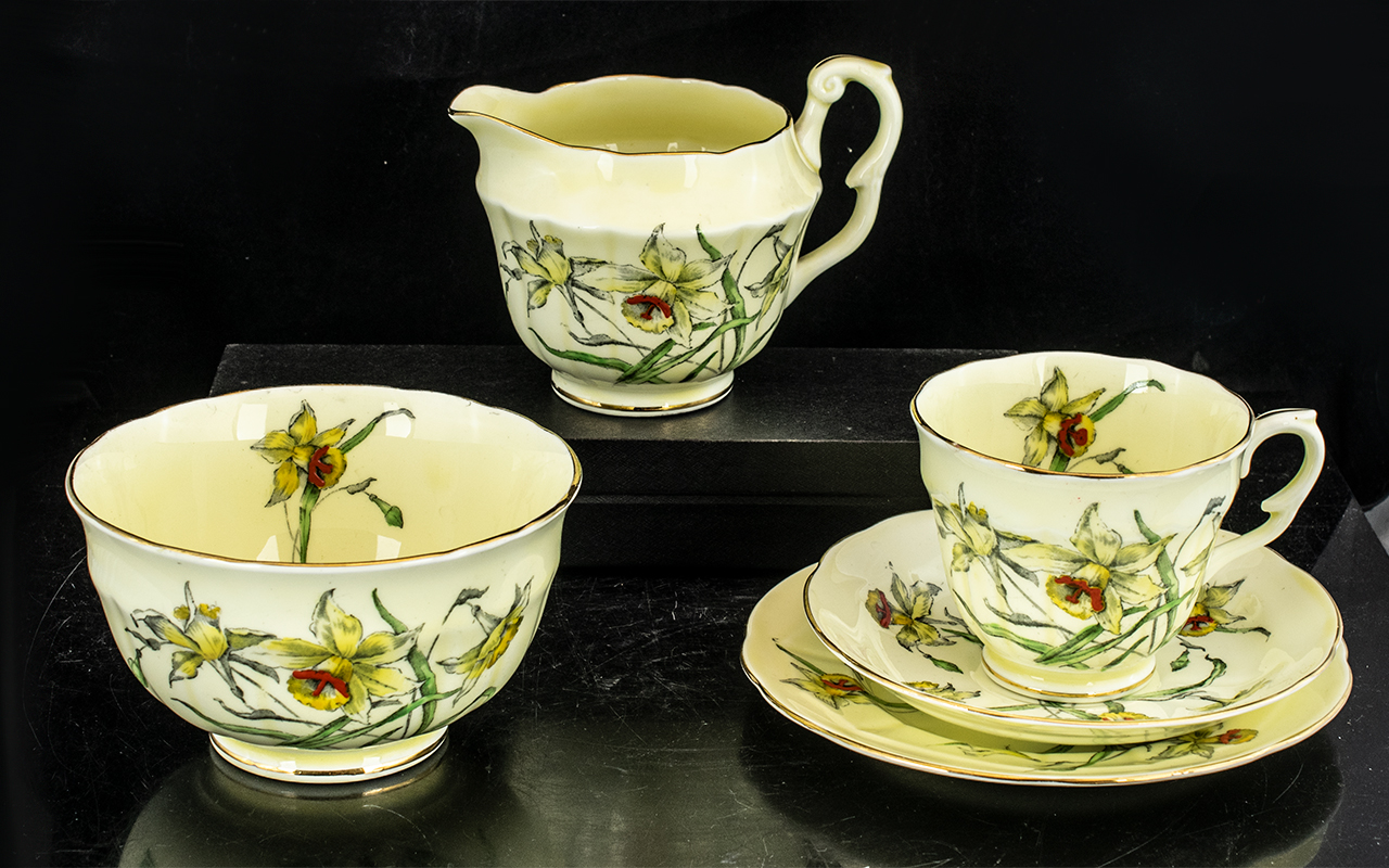 Staffordshire Crown Pottery Tea Service, in yellow ground decorated with daffodils, - Image 2 of 3