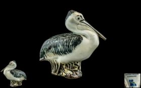 Royal Copenhagen brown and beige glazed figurine of a pelican, designed by Jeanne Grut.