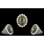 Silver Dress Ring stone set with pearl surround, ornate silver decorative sides. Marked for silver.