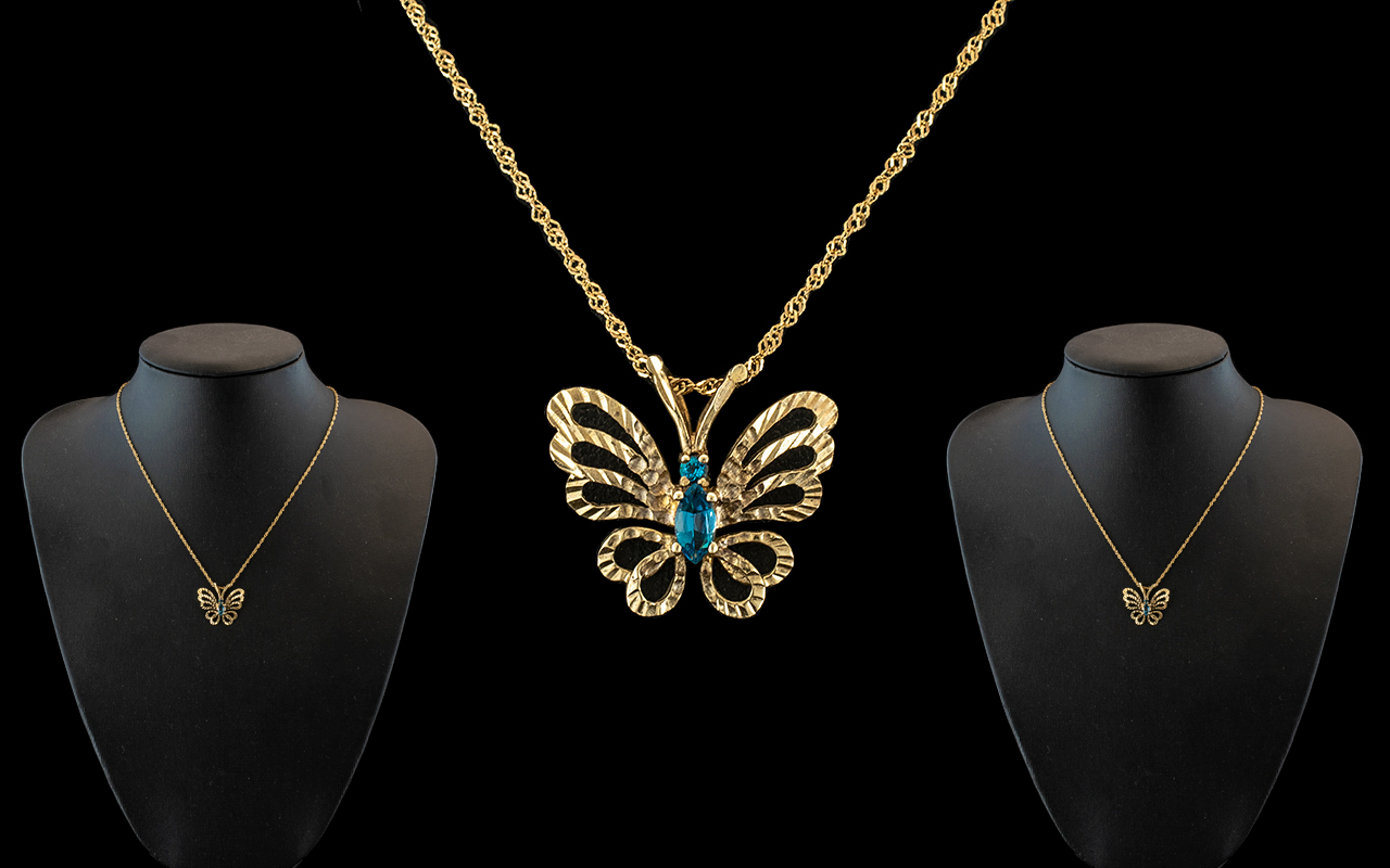 9ct Gold Butterfly Pendant - Suspended on 9ct Gold Chain.