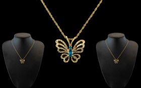 9ct Gold Butterfly Pendant - Suspended on 9ct Gold Chain.