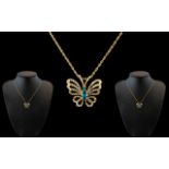 9ct Gold Butterfly Pendant - Suspended on 9ct Gold Chain.